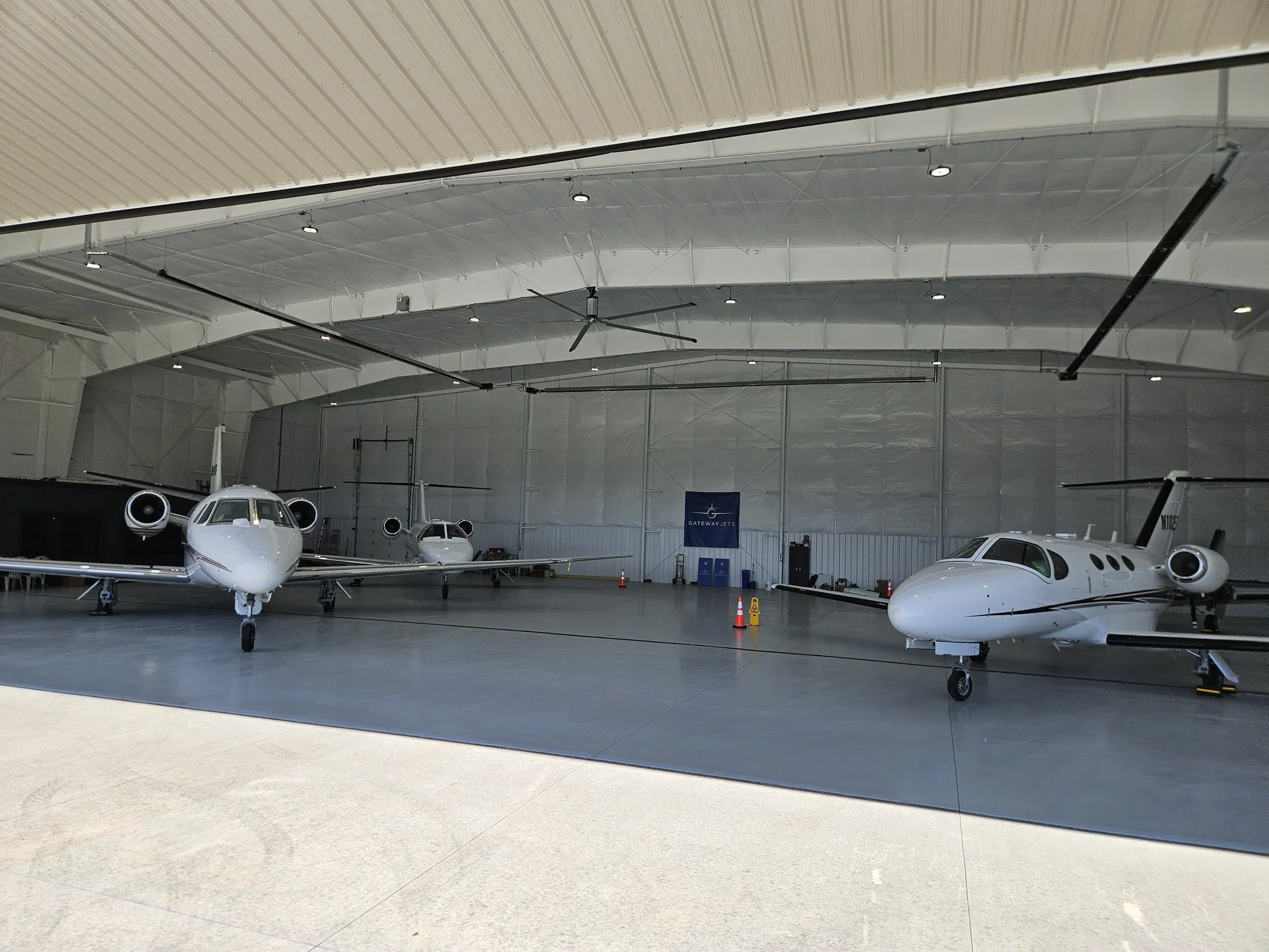 Inside the Gateway Jets hangar at KCPS, with Citations in covered storage
